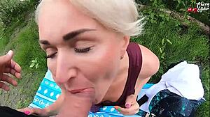 Hot blonde deepthroats dick in nature recreation.