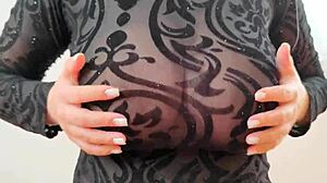 wearing sweatshirt revealing large breasts and nipples