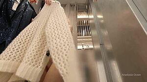 i try on clothes in the fitting room with an open curtain