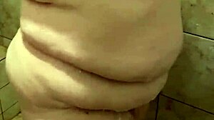 She's washing up in the shower, enjoying the bath