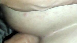 She straps on and fucks her ass deep in casual anal play