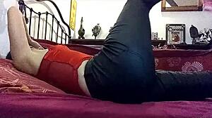 amateur milf in green leather pants and red satin bodysuit with heels