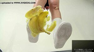 Asian girl crushes banana in food fetish video