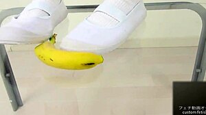 Asian girl crushes banana in food fetish video