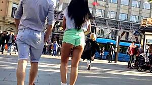 girl in booty shorts walks the street