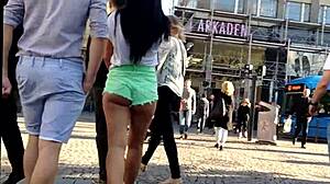 girl in booty shorts walks the street