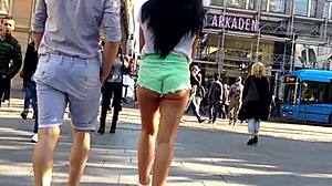 girl in booty shorts walks the street