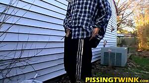 A group of twinks gathers in a gay fetish scene, splashing piss from their cocks during solo masturbation.