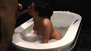 Stunning vixen blows and bangs in bathtub