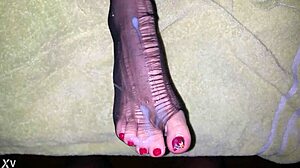 Detailed cumshot on creamy feet in stockings, toes exposed