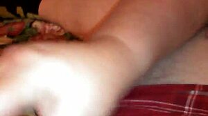 mature woman gives huge handjob to big tits