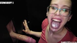 Jackie handles monster cock at gloryhole, swallowing every drop