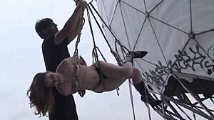 Young girl 18 years gets tied in public hanging bondage in Berlin.