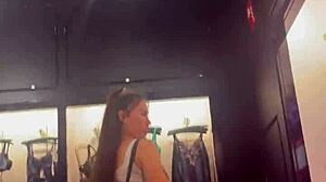 Young amateur strips naked in the street while shopping for lingerie.