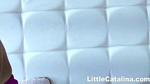 Little Catalina plays in bed with her tight pussy.