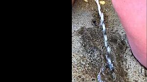 my wife peeing on the beach for a long time