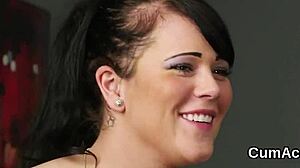 A foxy hottie receives a cumshot on her face and gulps all the semen.