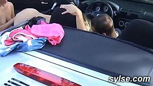 Two lesbian hitchhikers in a trio with toys in the fields