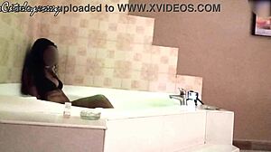 Photographer captures pretty Latina in lingerie during jacuzzi photoshoot