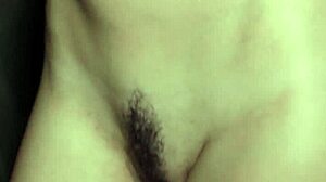 I watch petite brunette Elilith Noir strip in lingerie.