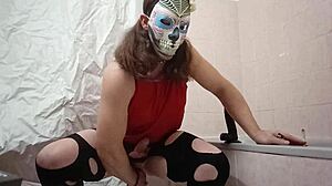 A travesti explores toys with a dildo in this narrative