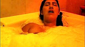 A milf masturbates in the bath before getting fucked