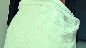 Blonde slut flashes her big ass and tits in a towel at the window!