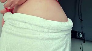 Blonde slut flashes her big ass and tits in a towel at the window!