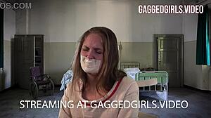 Teach Rachel Adams how to treat choking and gagging fetish by taping her gagged