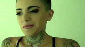 Does this tattooed lesbian with small tits enjoy rimming?