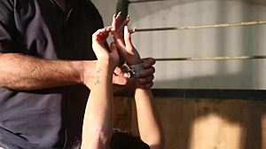 luna lies chained and nude in the stables, barefoot and bound for submission