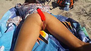 Feeling intense pleasure from dildo fucking and creampie on nudist beach with brunette