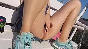 Brunette babe flashes butt plug and pees in lavender fields.