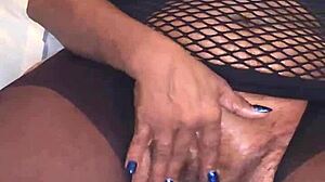 I'm twisting and sucking my wet nipples while fingering my pussy.