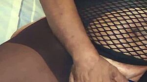 I'm twisting and sucking my wet nipples while fingering my pussy.