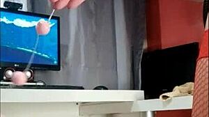 she's shoving those anal balls up her ass one by one, close up