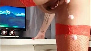 she's shoving those anal balls up her ass one by one, close up