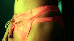 Britney Amber masturbates against blue wall