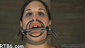 Fascinating beauty caged with another stunning babe