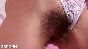 sexy brunette fucks wet hairy pussy with dildo