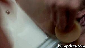 mature woman inserts two toys and squirts.