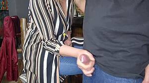 After work, my stepmom started jerking me off in a casual, sneaky moment at home while still clothed.