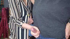 After work, my stepmom started jerking me off in a casual, sneaky moment at home while still clothed.