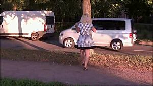 Street upskirt tease from a cute horny milf in a sexy dress