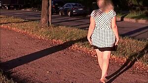 Street upskirt tease from a cute horny milf in a sexy dress