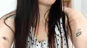 The naughty milf plays with a lollipop in her wet pussy