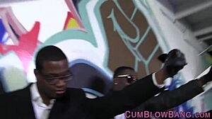 Blacked bitch tugs cocks in group blowbang