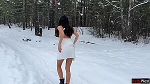 A young couple engages in rough blowjob and doggystyle sex in a snowy forest, leading to intense orgasms and facials