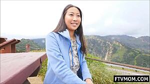 Look at this busty asian milf flashing her big tits outdoors!