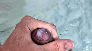 Chubby guy jerking off until he finishes in the shower with intense homemade action.